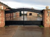 Gate 41 Distinctive wrought iron automated gate on underground hydraulic gate motors, with vertical saftey edges and GSM intercom. Shaftholme, Doncaster. 