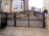 Gate 42 remote control  wrought iron gate with matching pedestrian gate and fencing on underground hydraulic gate motors 